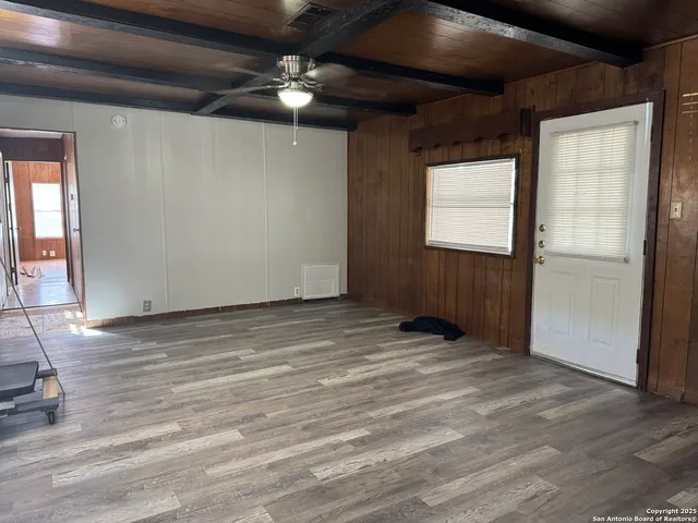 a view of an empty room with a window