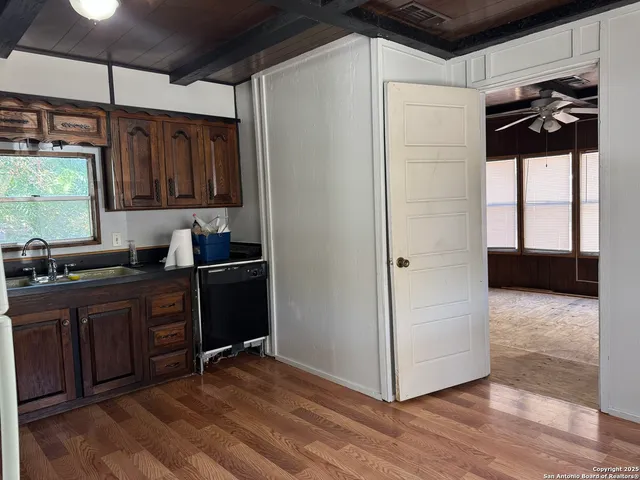 a kitchen with a refrigerator and a sink