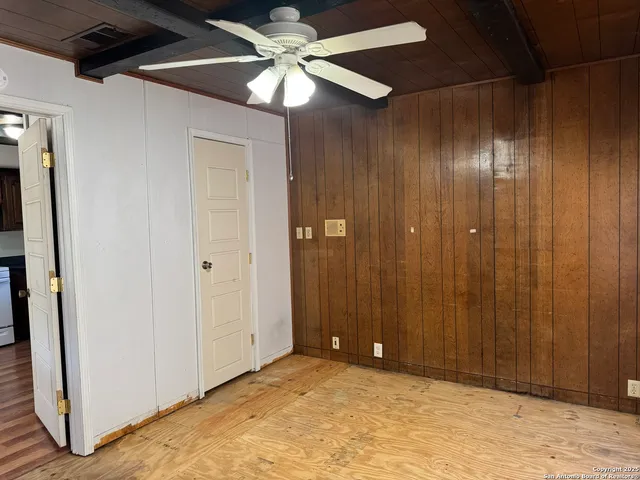 an empty room with closet area
