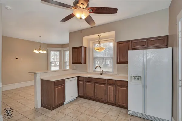 a kitchen with a sink stainless steel appliances and cabinets