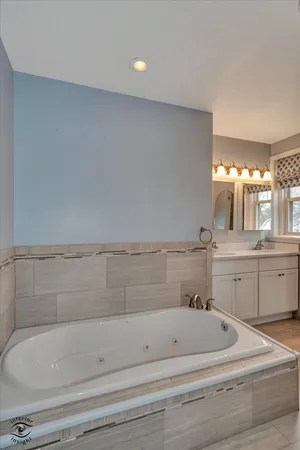 a bathroom with a bathtub and shower