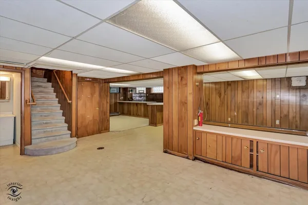 a view of an empty room with wooden walls