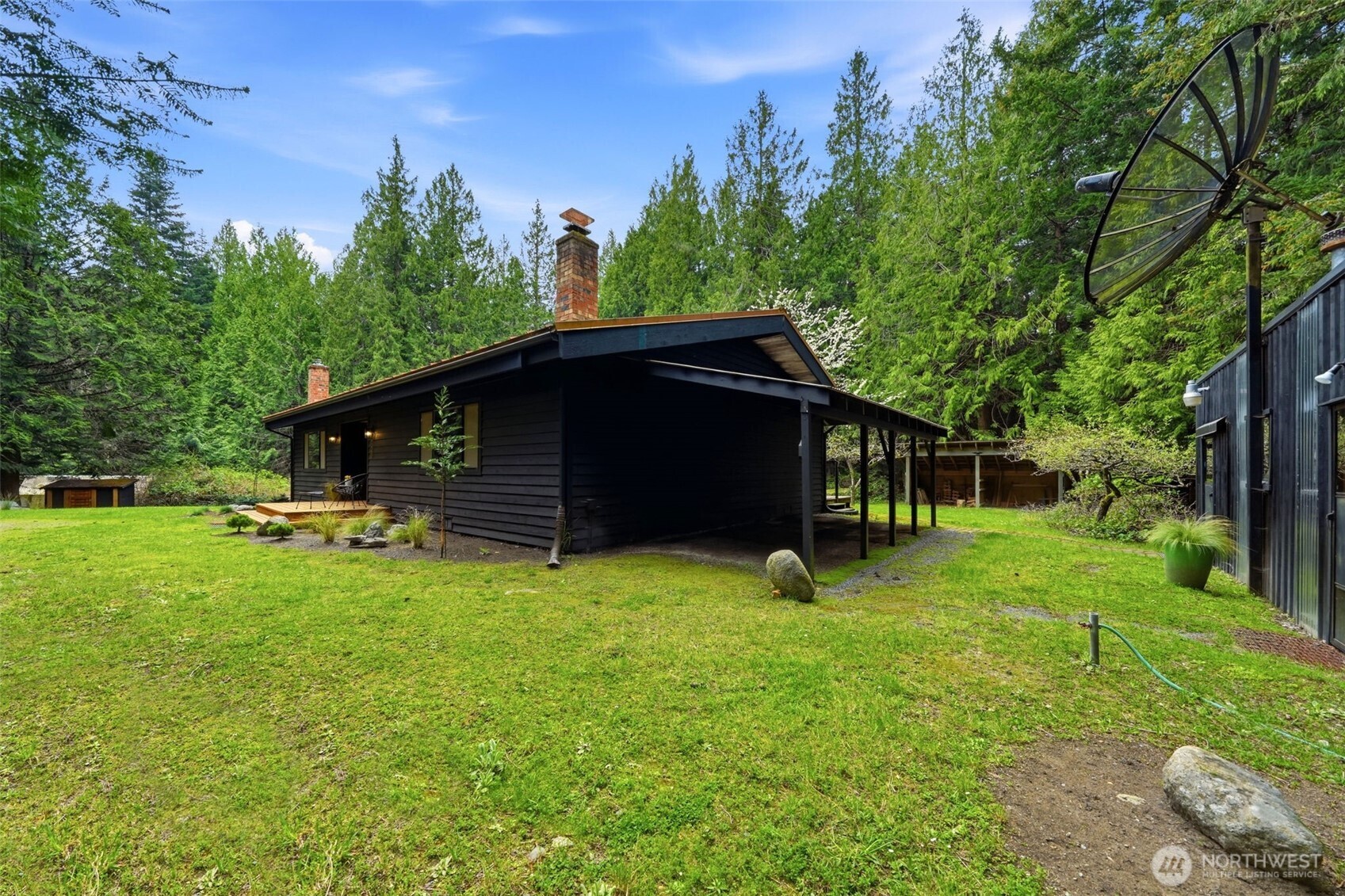 102 Byron Road Friday Harbor, WA 98250 - Photo 20 of 40 a view of backyard with a barn and large trees
