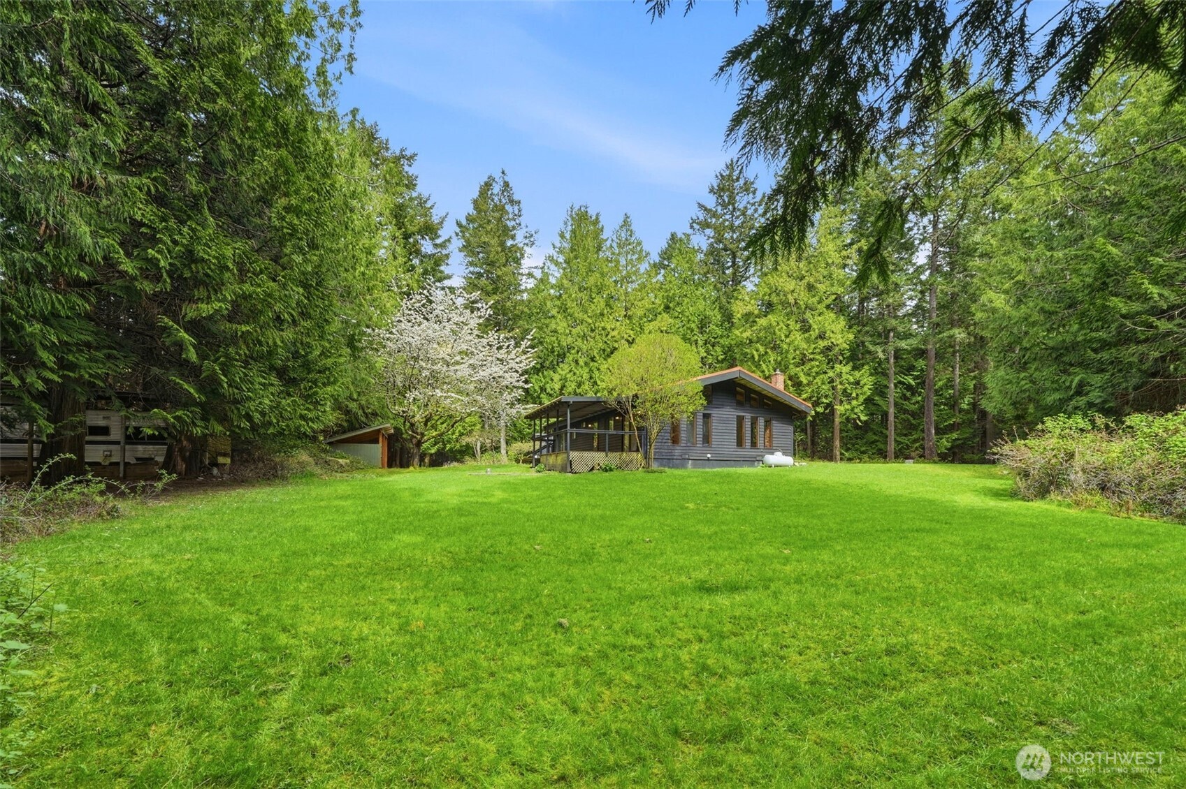 102 Byron Road Friday Harbor, WA 98250 - Photo 32 of 40 a view of a large garden with plants and large trees