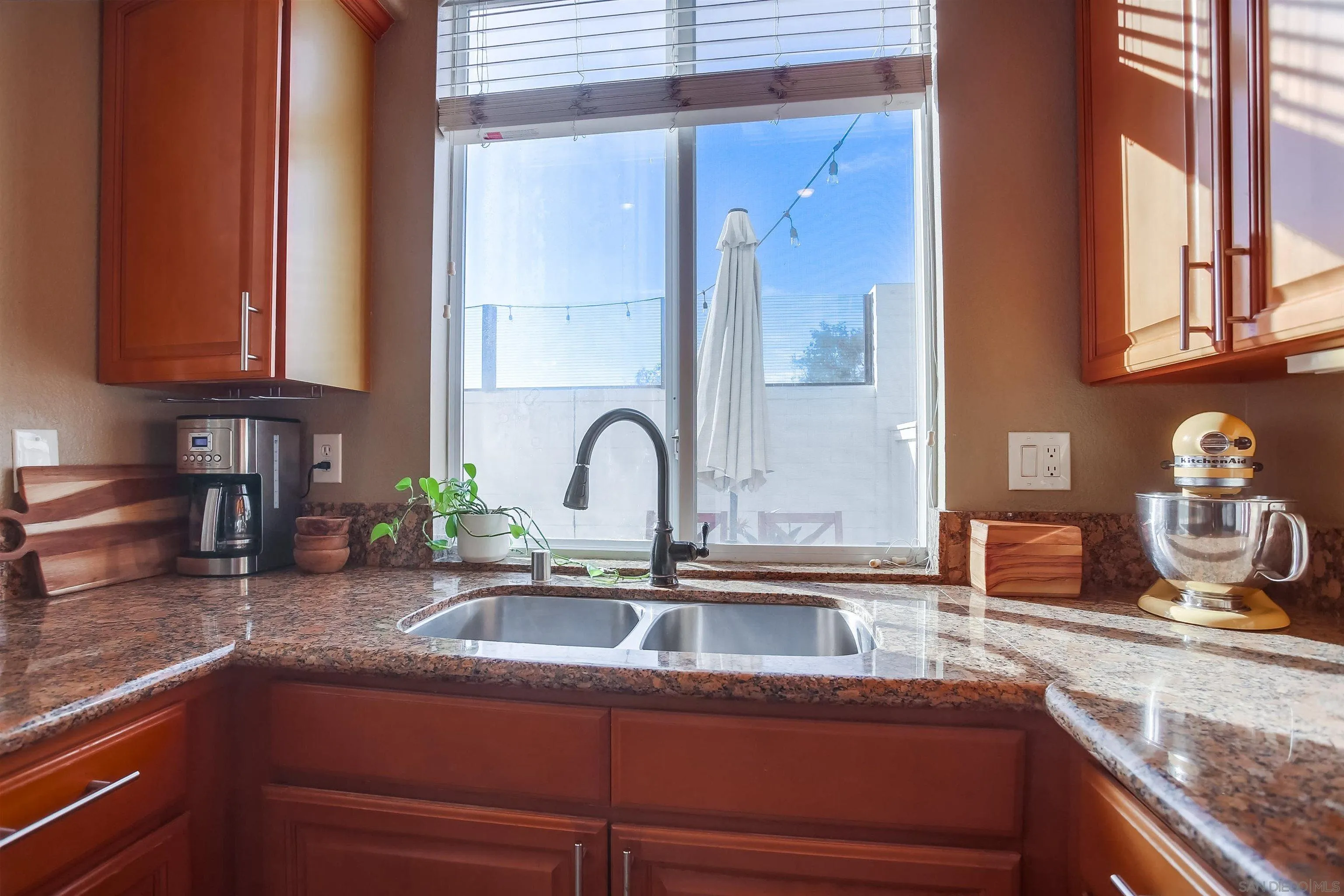 382 Carmel Creeper Place Encinitas, CA 92024 - Photo 14 of 43 a kitchen with a sink and cabinets