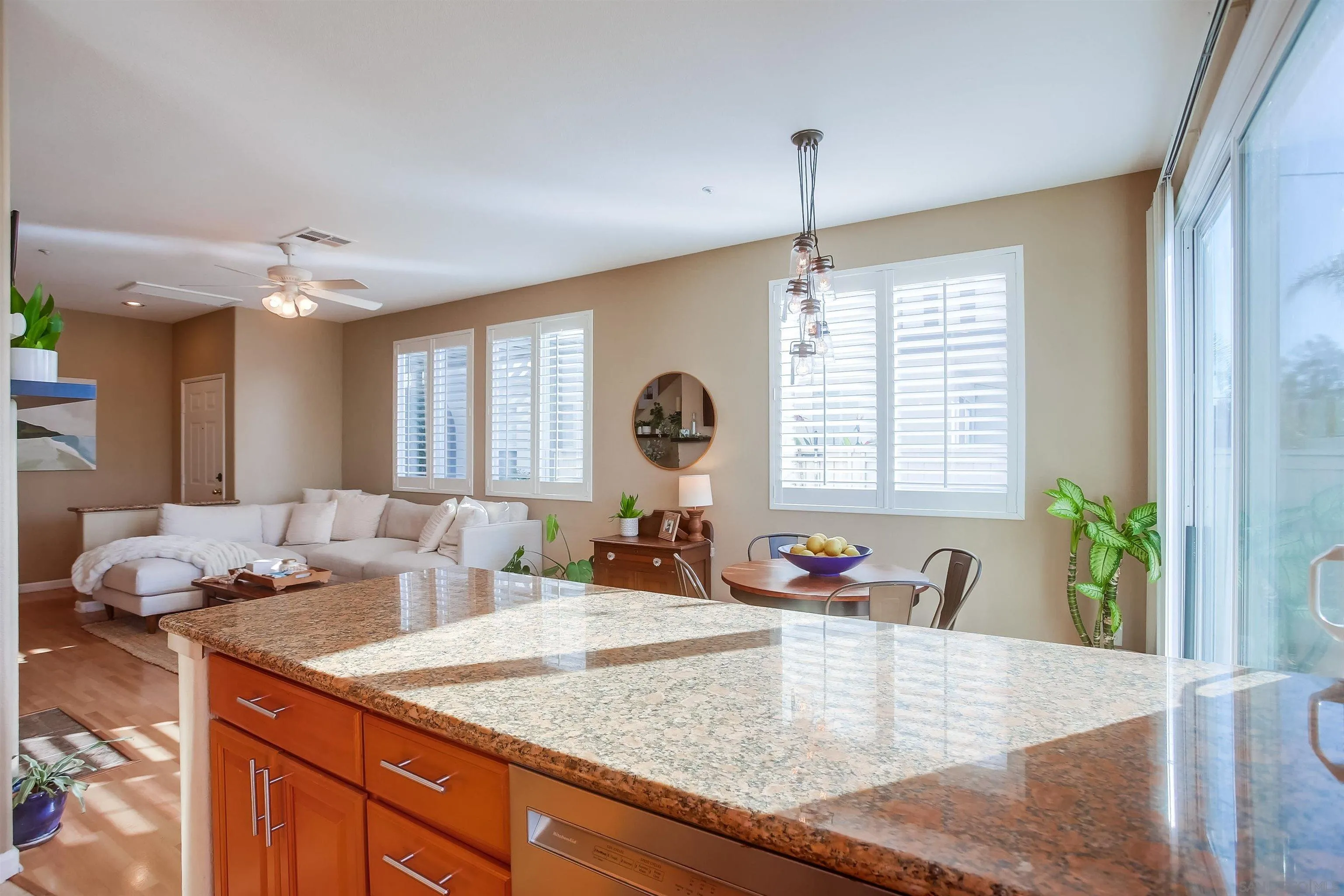 382 Carmel Creeper Place Encinitas, CA 92024 - Photo 16 of 43 a kitchen with sink refrigerator and window