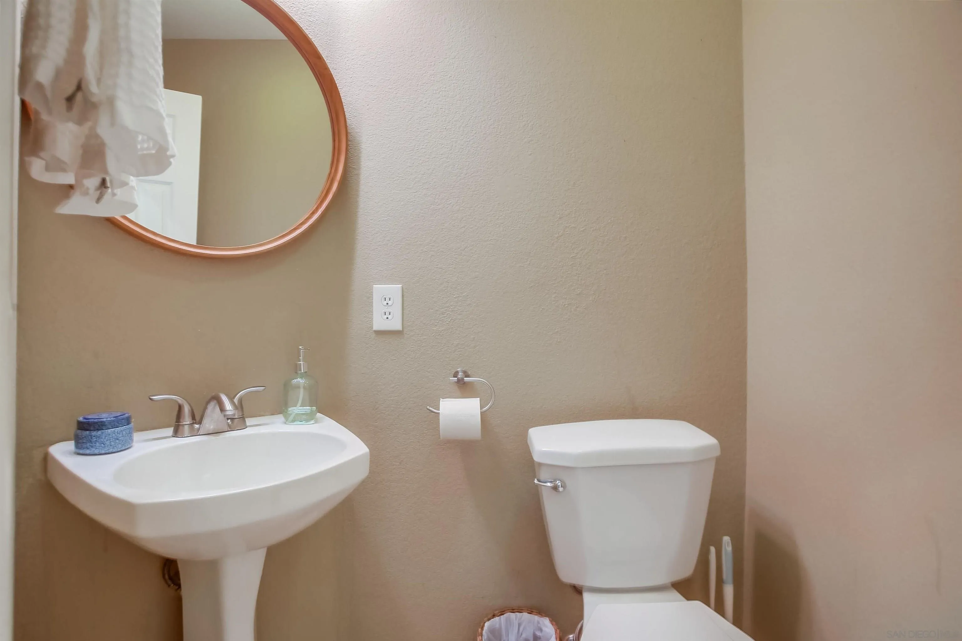 382 Carmel Creeper Place Encinitas, CA 92024 - Photo 17 of 43 a bathroom with a sink and a toilet