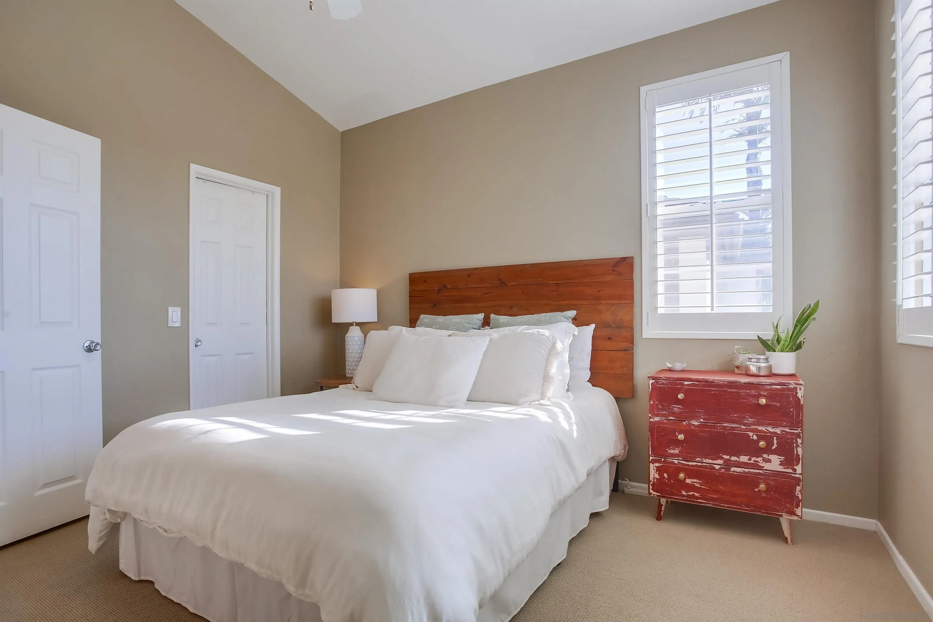 382 Carmel Creeper Place Encinitas, CA 92024 - Photo 27 of 43 a bedroom with a bed and window