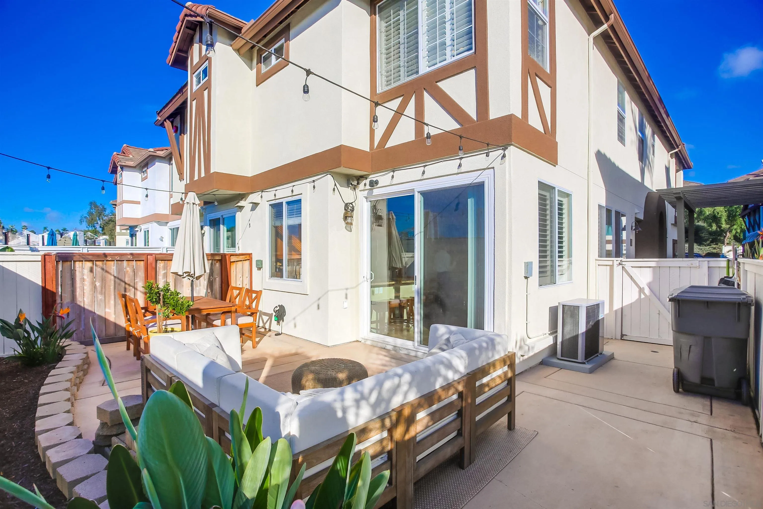 382 Carmel Creeper Place Encinitas, CA 92024 - Photo 33 of 43 a backyard of a house with outdoor seating