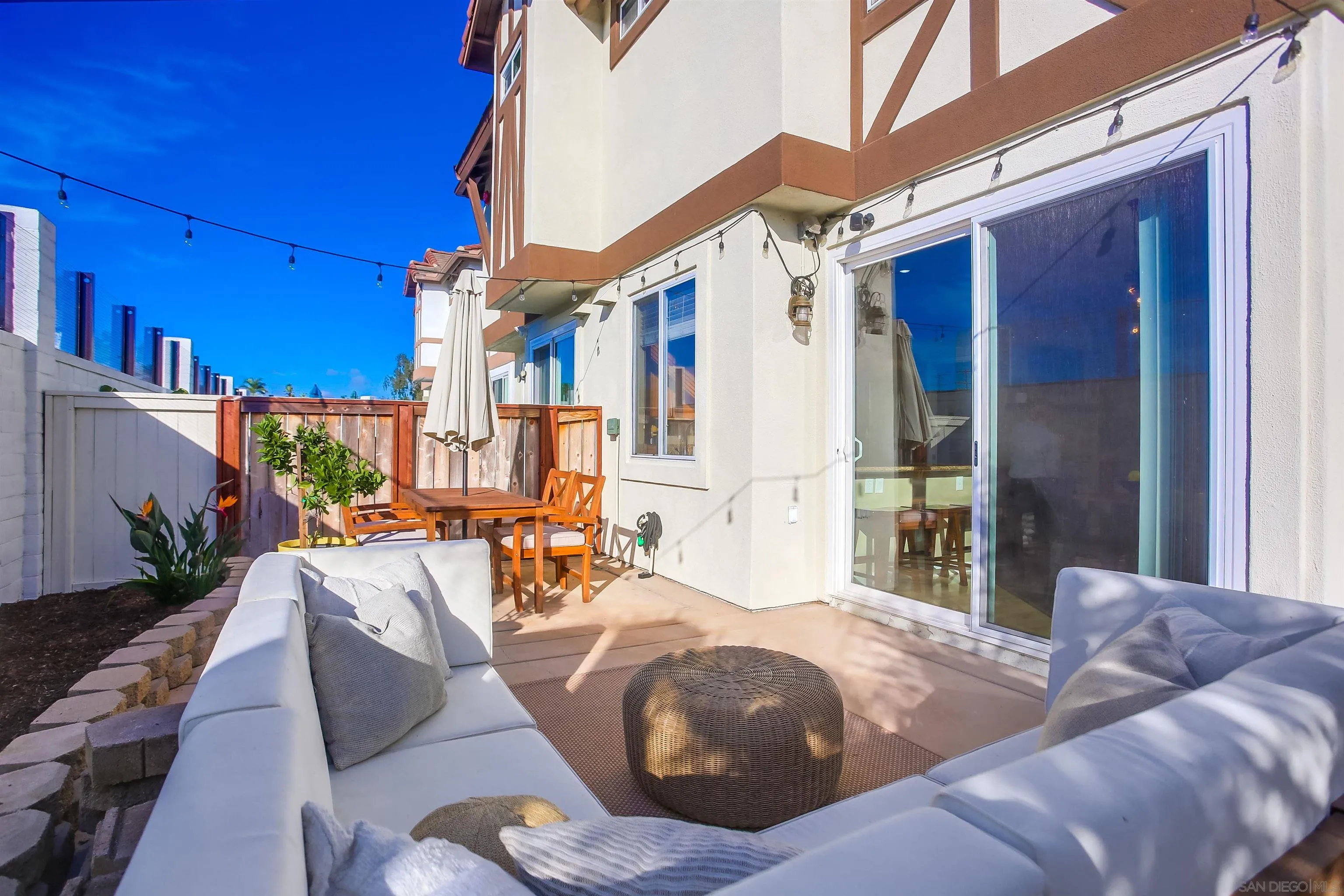 382 Carmel Creeper Place Encinitas, CA 92024 - Photo 34 of 43 a view of a patio with couches and potted plants