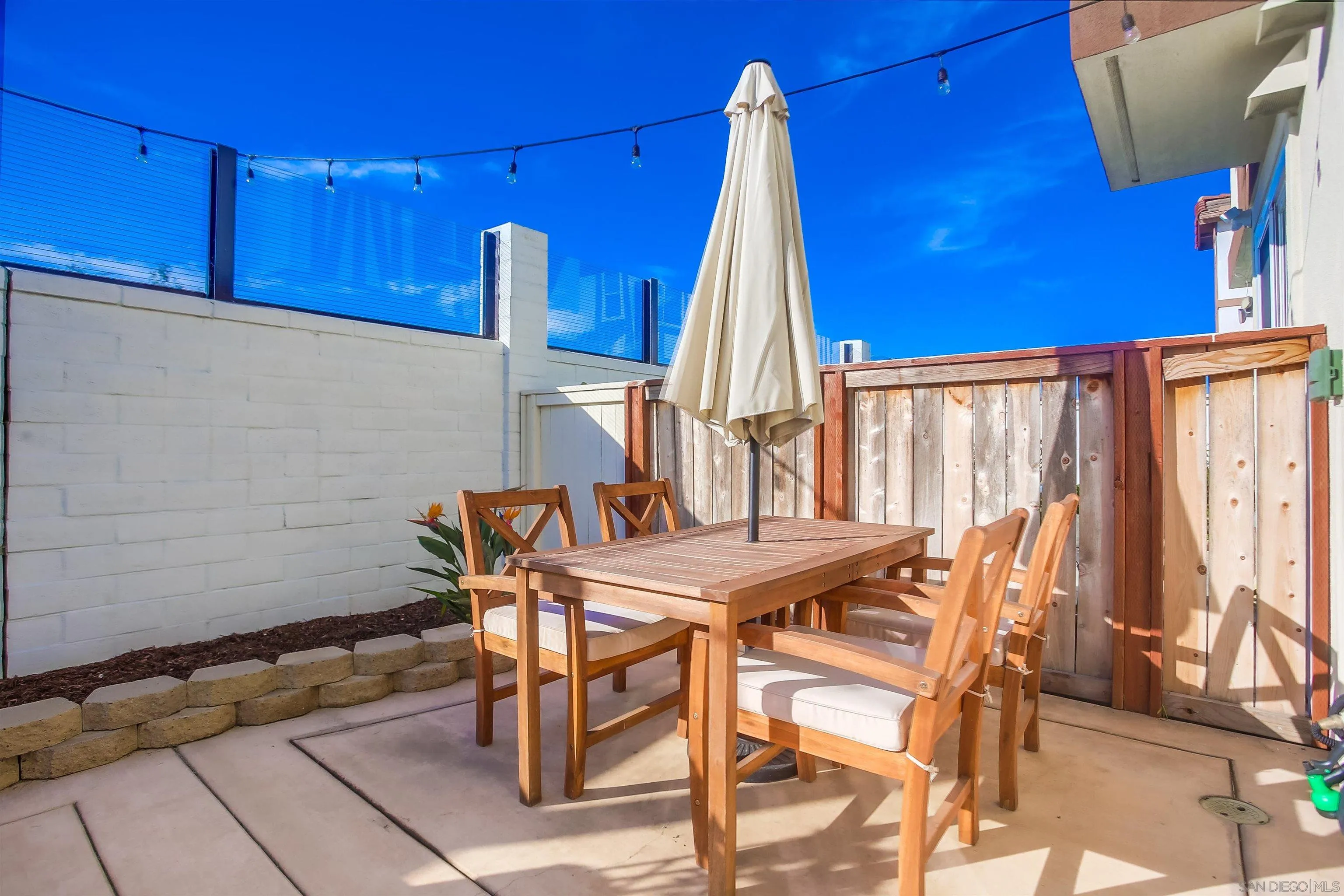 382 Carmel Creeper Place Encinitas, CA 92024 - Photo 37 of 43 a view of a dining room with furniture and a window