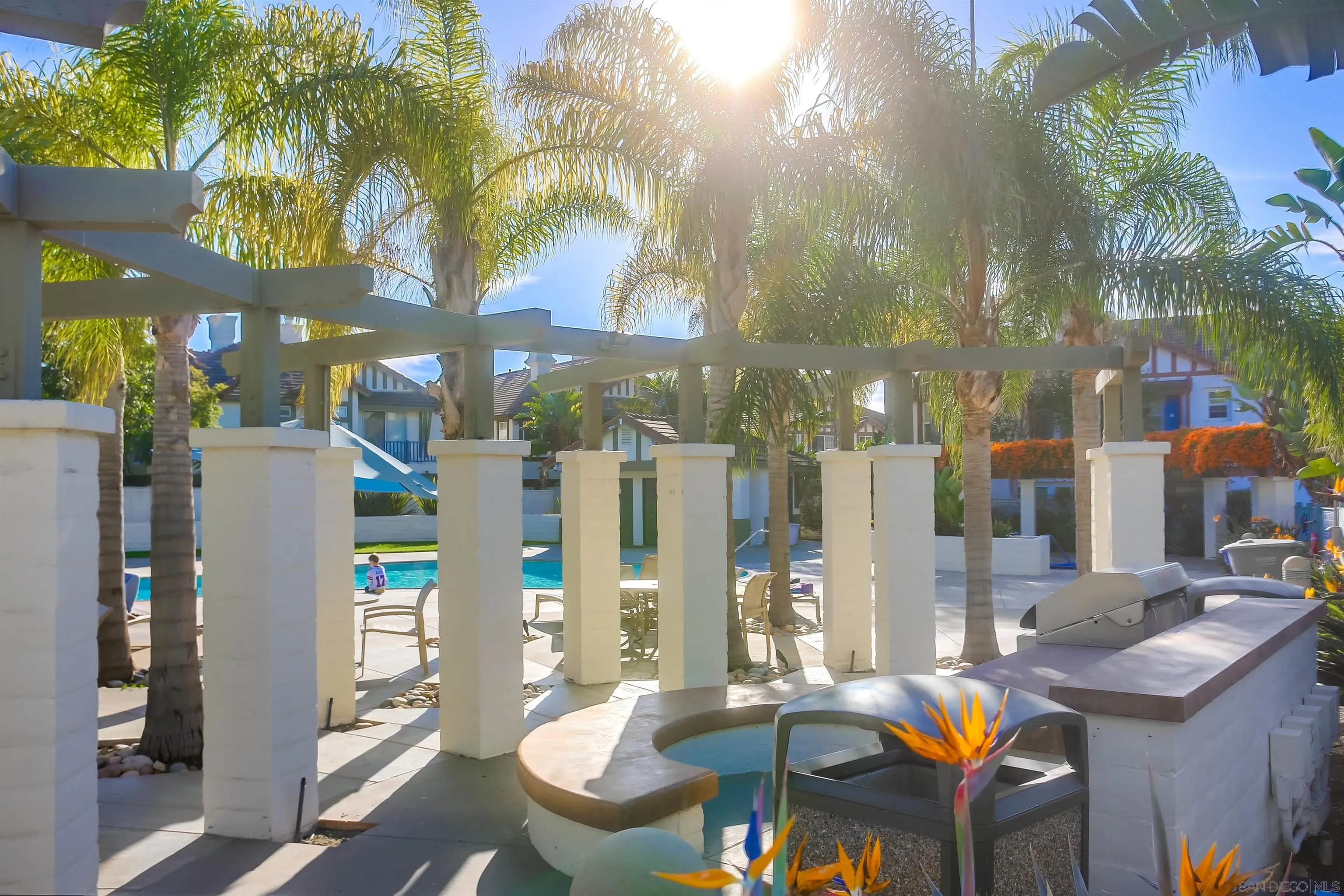 382 Carmel Creeper Place Encinitas, CA 92024 - Photo 41 of 43 a view of a dinning tables and chairs in a patio