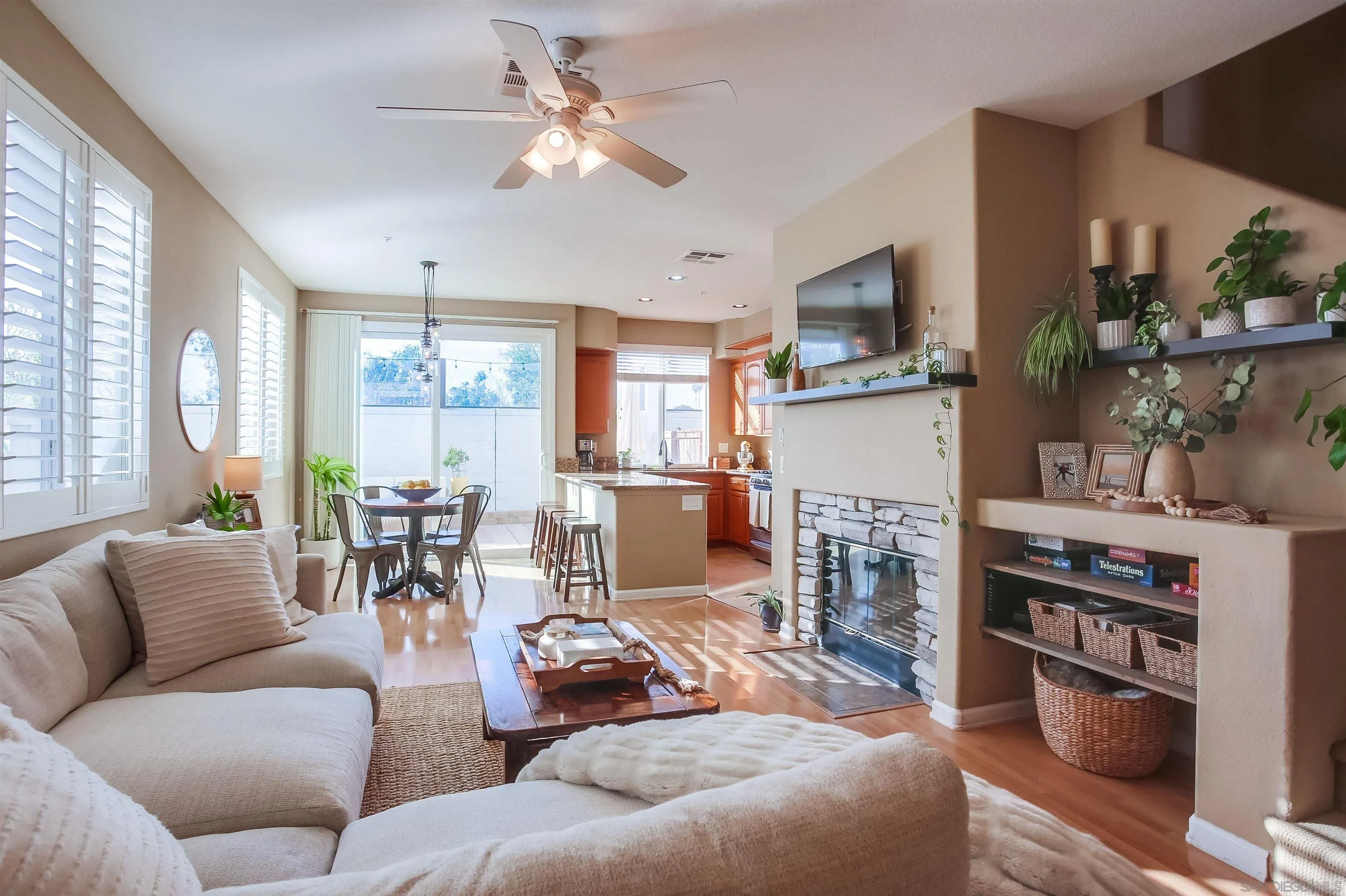 382 Carmel Creeper Place Encinitas, CA 92024 - Photo 5 of 43 a living room with furniture a fireplace and a large window