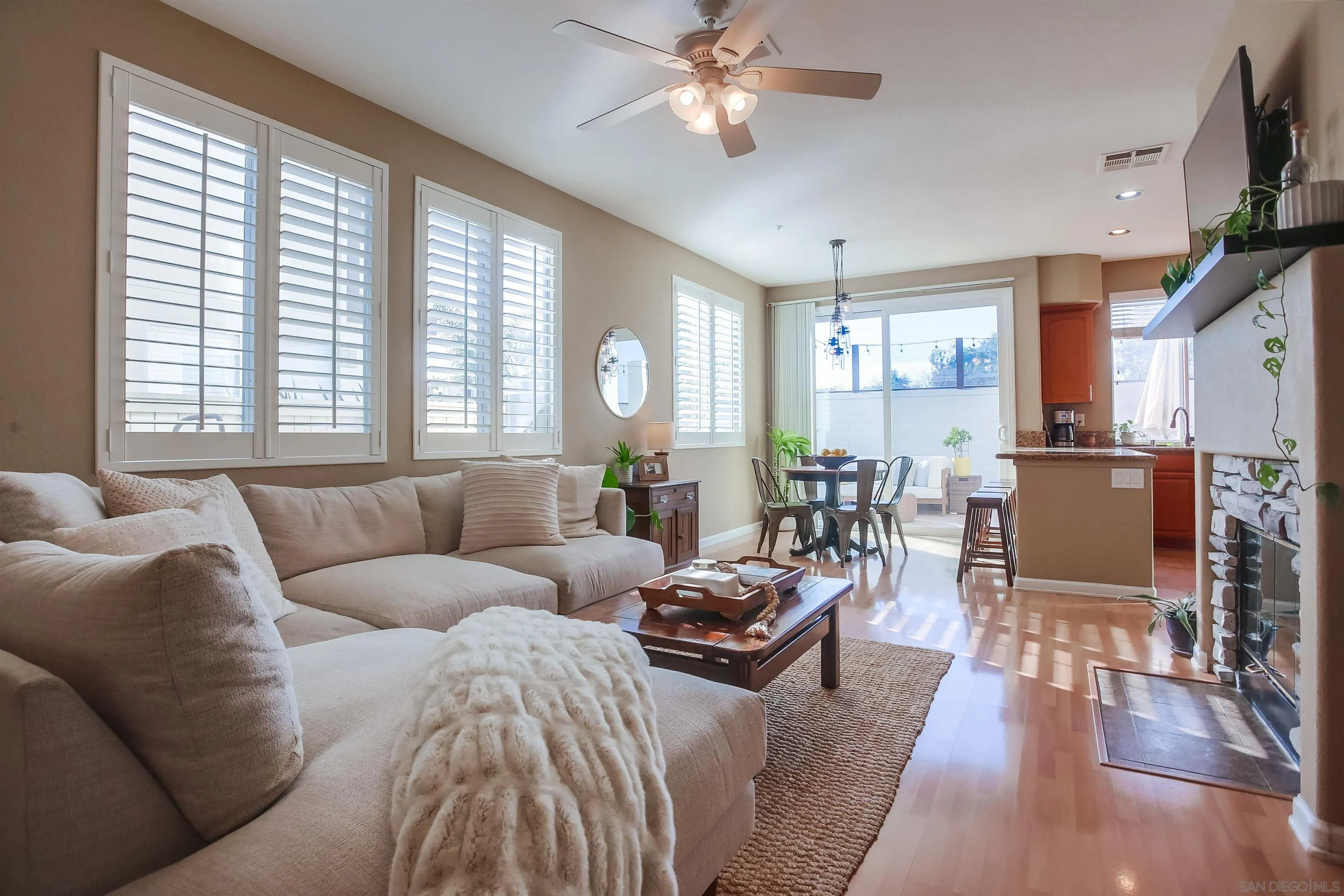 382 Carmel Creeper Place Encinitas, CA 92024 - Photo 6 of 43 a living room with furniture wooden floor and a large window