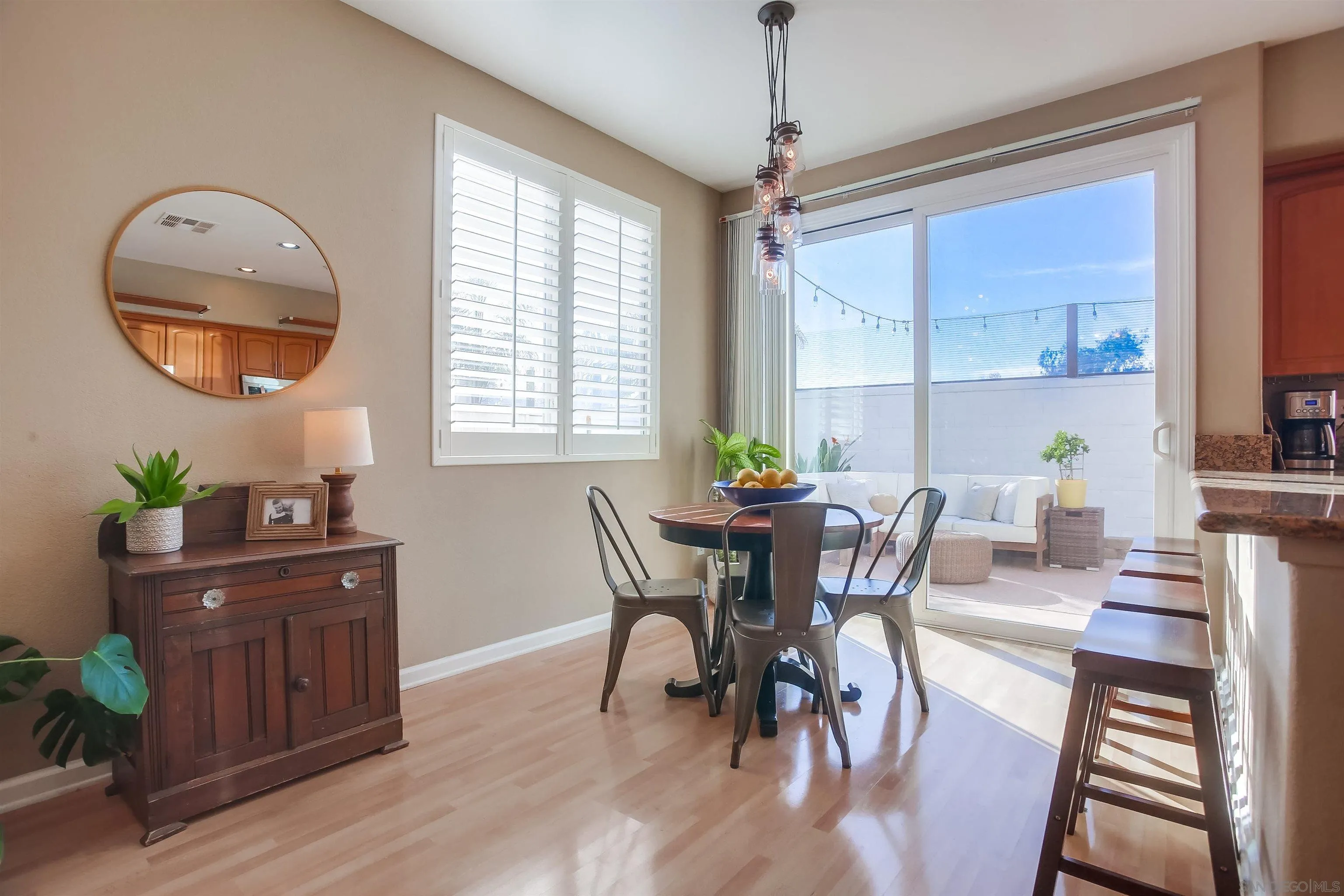 382 Carmel Creeper Place Encinitas, CA 92024 - Photo 10 of 43 a view of a dining room with furniture window and wooden floor