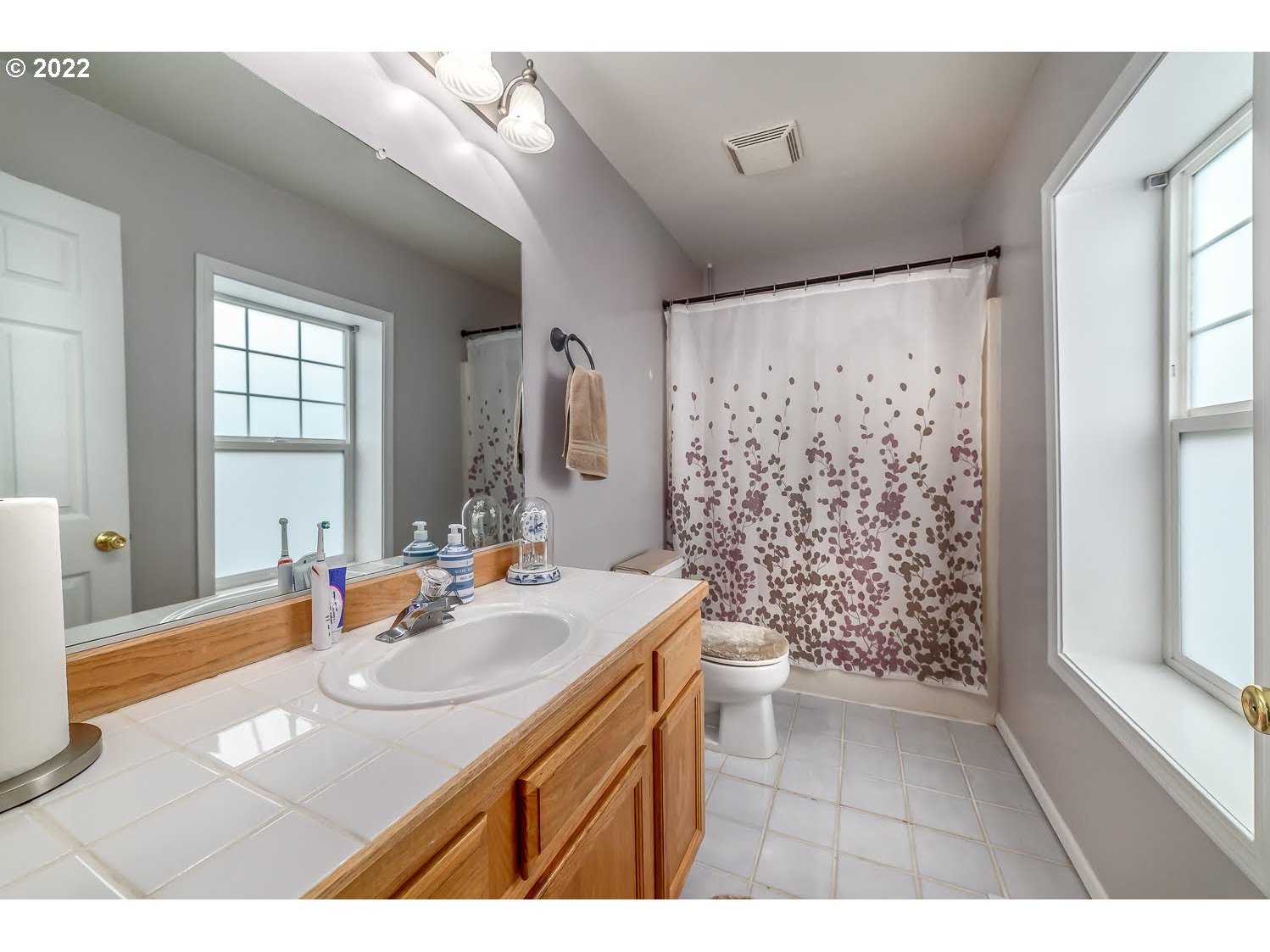331 South 46th Street Springfield, OR 97478 - Photo 19 of 28 a bathroom with a sink double vanity and a shower