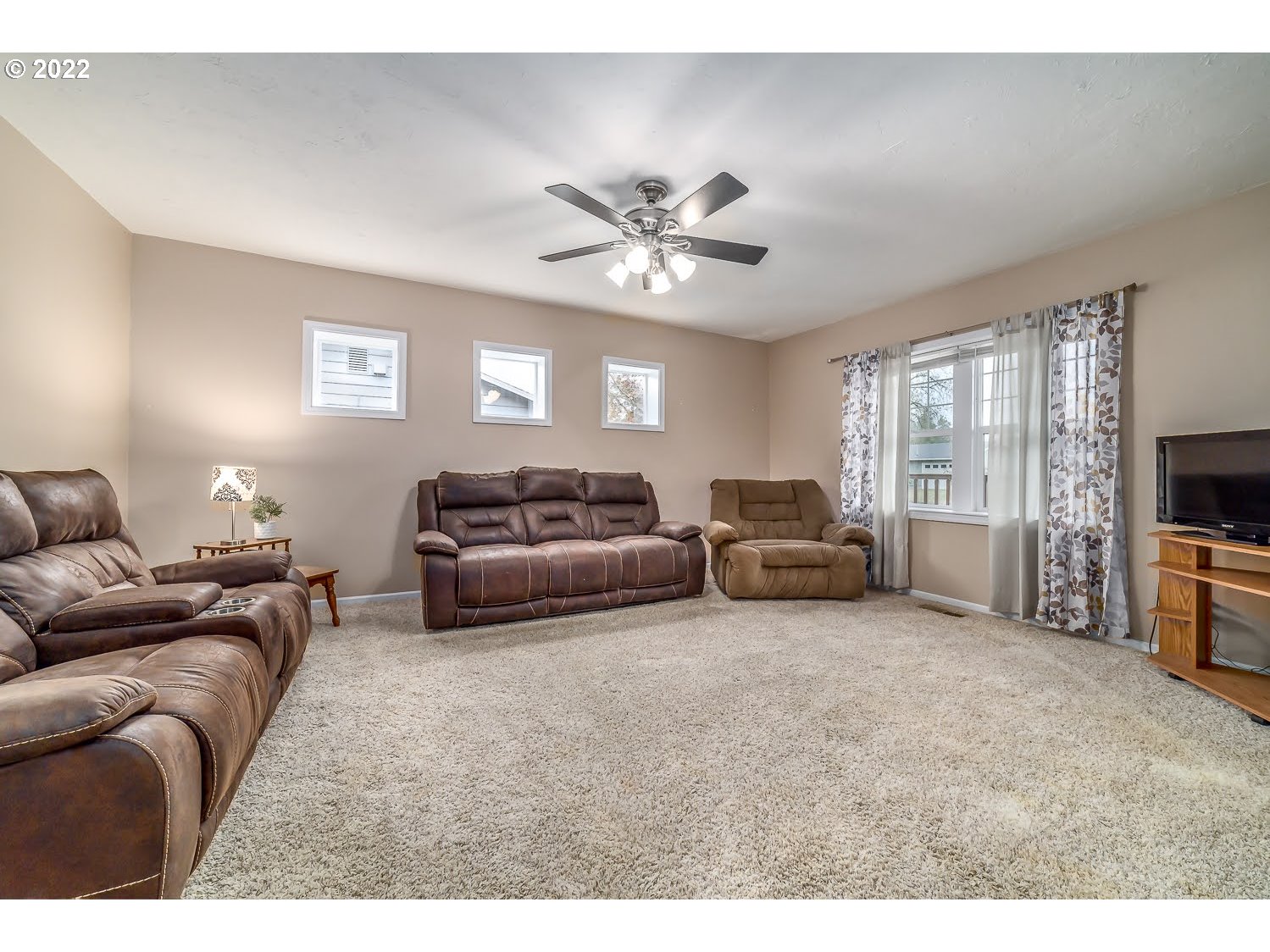 331 South 46th Street Springfield, OR 97478 - Photo 7 of 28 a living room with furniture and a flat screen tv