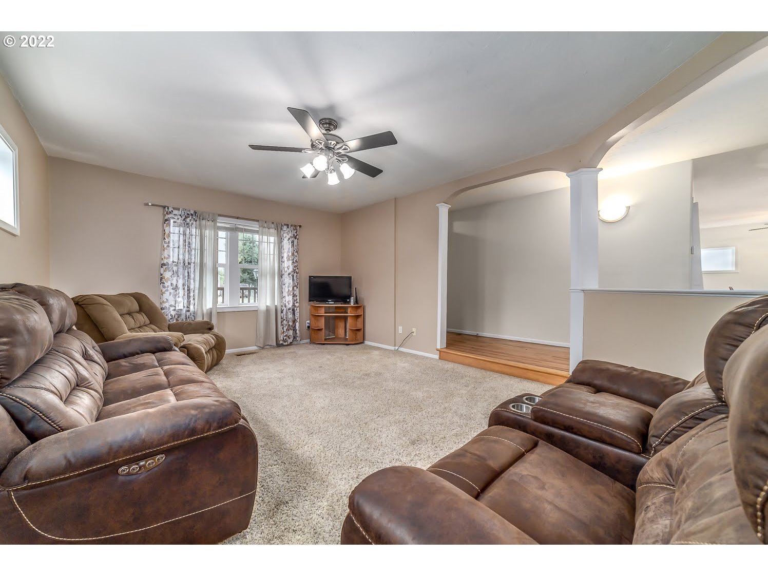 331 South 46th Street Springfield, OR 97478 - Photo 8 of 28 a living room with furniture a large window and a chandelier