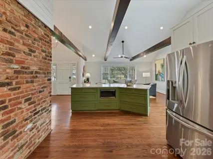 a kitchen with a refrigerator and a sink