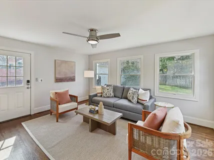 a living room with furniture and a window