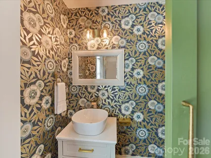 a bathroom with a toilet and a sink