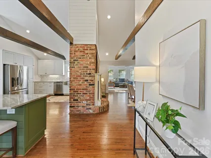 a lobby with furniture and wooden floor