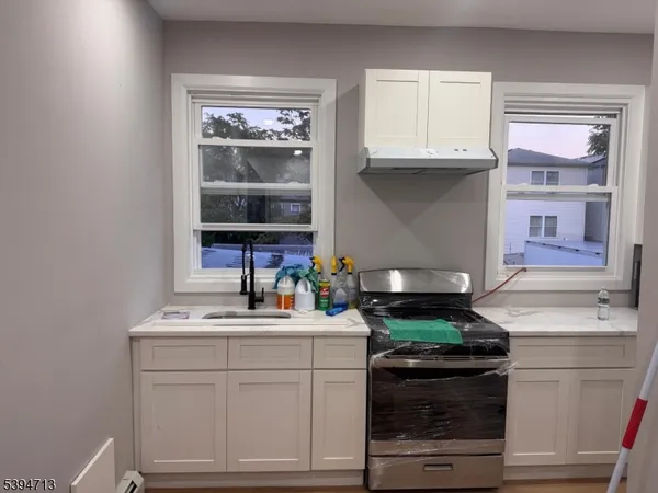 a kitchen with a stove and a sink