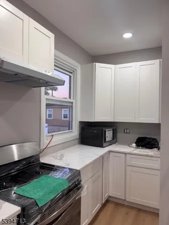 a kitchen with a stove and a sink