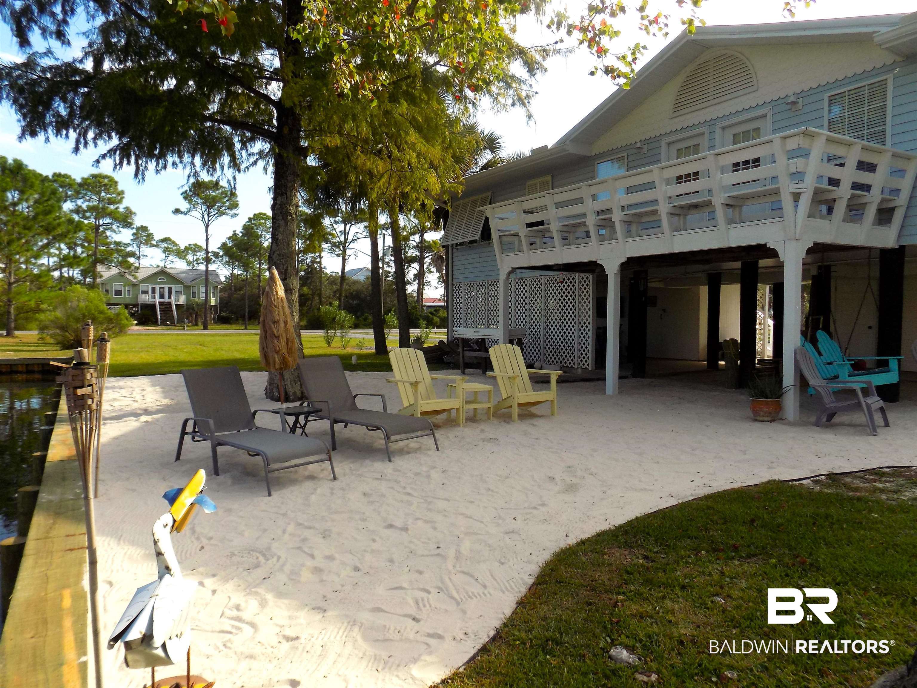 304 Windmill Ridge Road Gulf Shores, AL 36542 - Photo 21 of 29 View of patio / terrace featuring a wooden deck