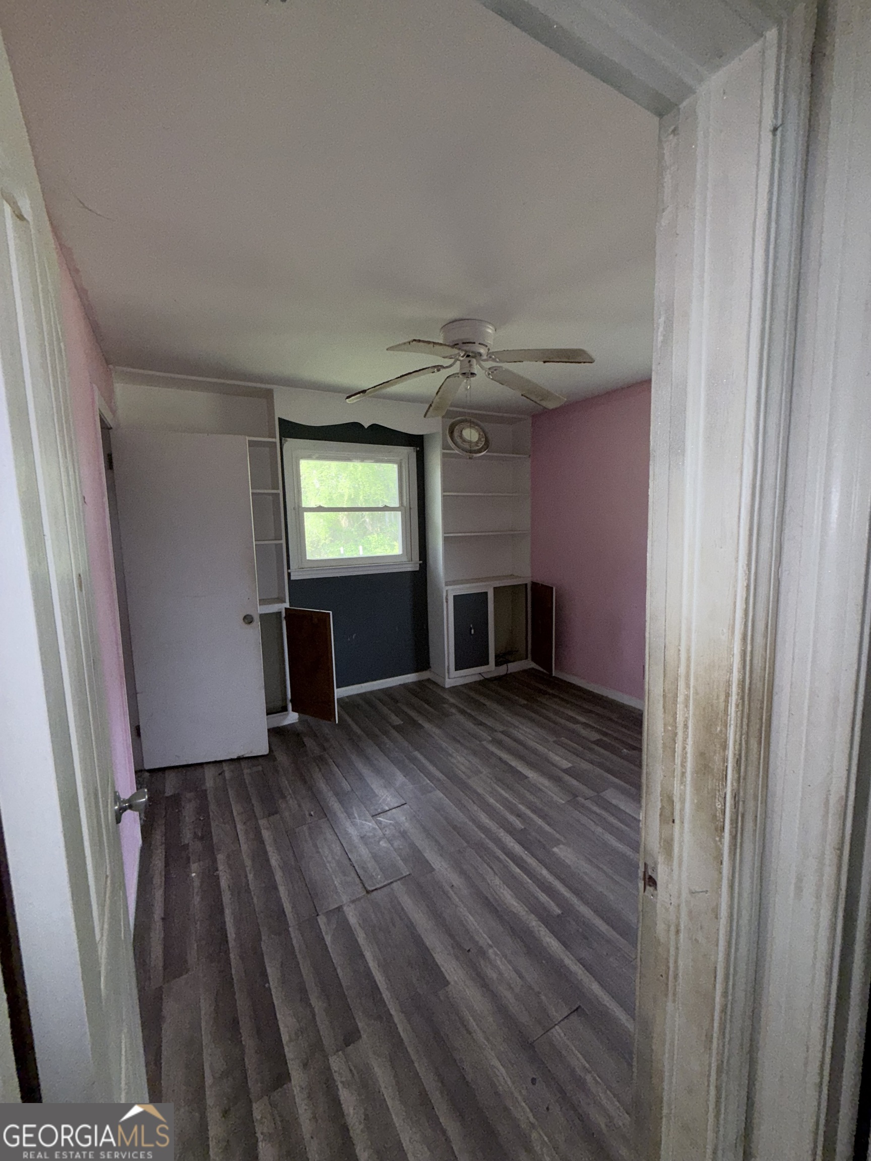 605 Perryman Bridge Road Heflin, AL 36264 - Photo 25 of 52 a view of empty room with wooden floor and fan
