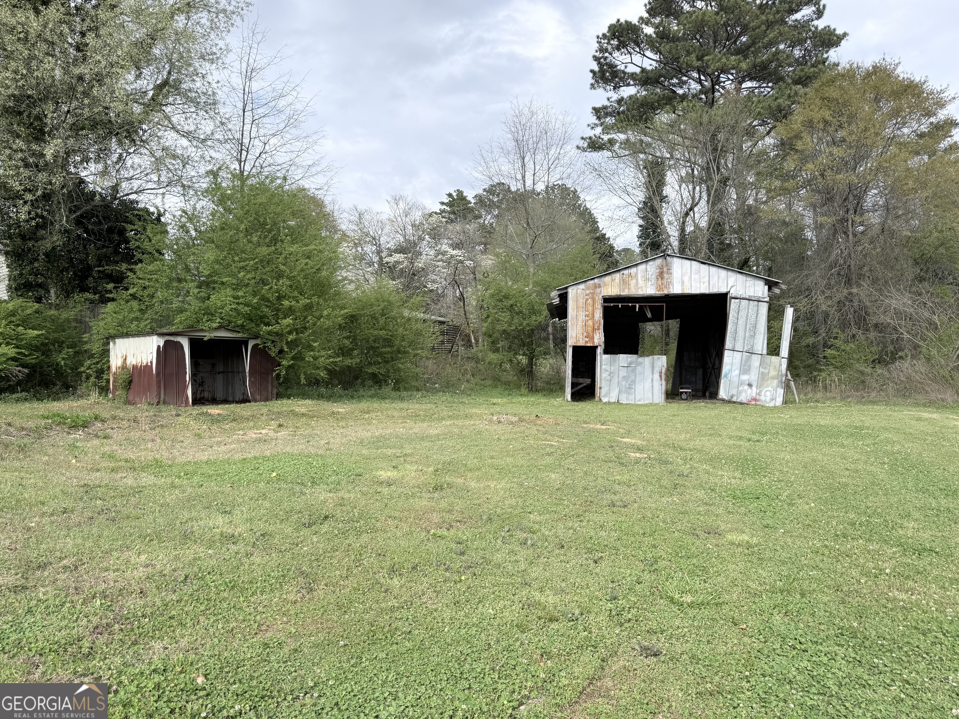 605 Perryman Bridge Road Heflin, AL 36264 - Photo 40 of 52 a view of a wooden house with a yard