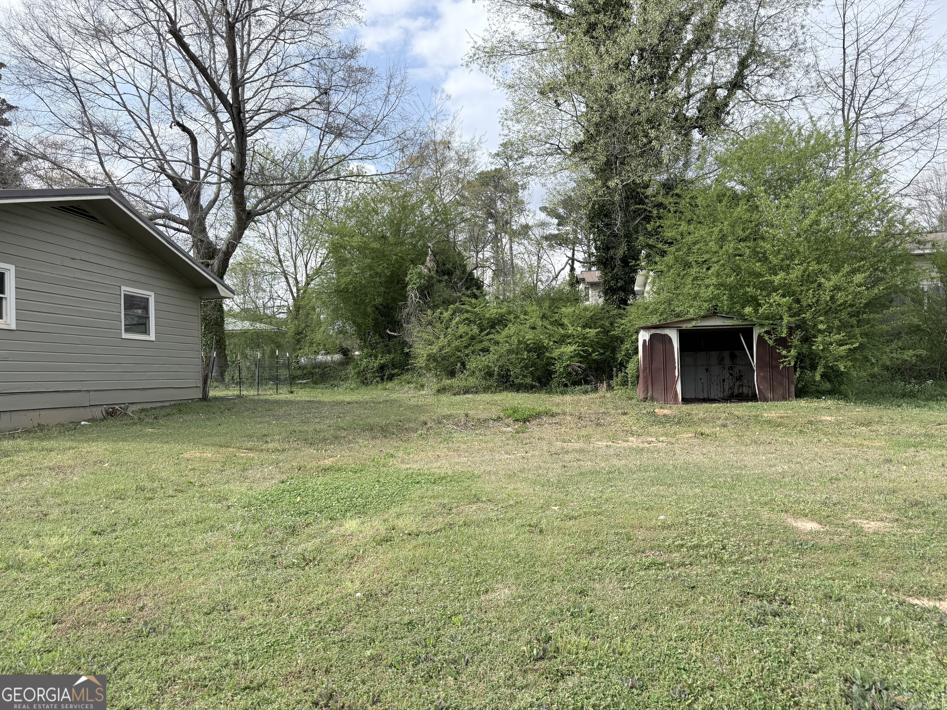 605 Perryman Bridge Road Heflin, AL 36264 - Photo 4 of 52 a view of a backyard with large trees