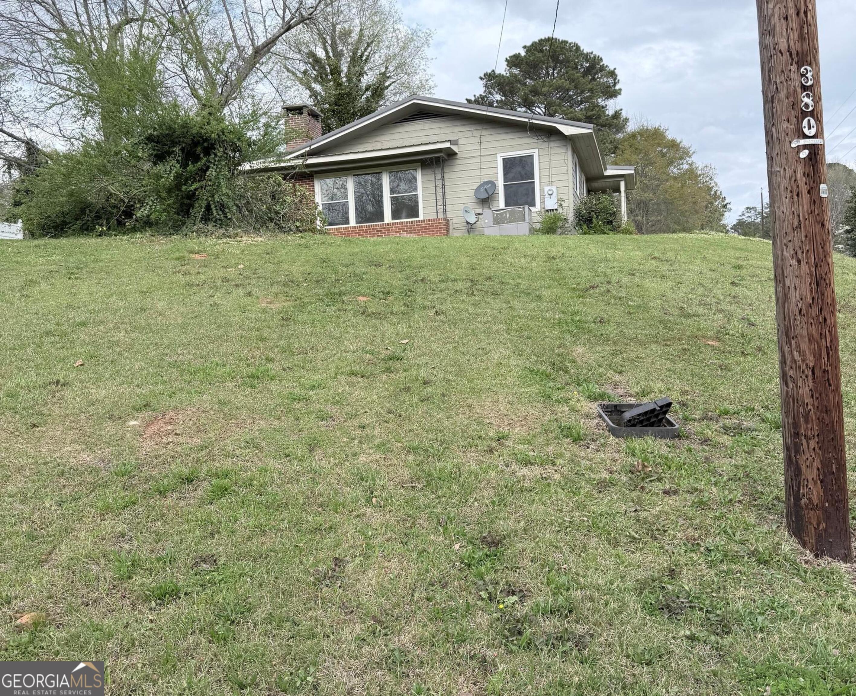 605 Perryman Bridge Road Heflin, AL 36264 - Photo 51 of 52 a view of a yard in front of a house with large trees