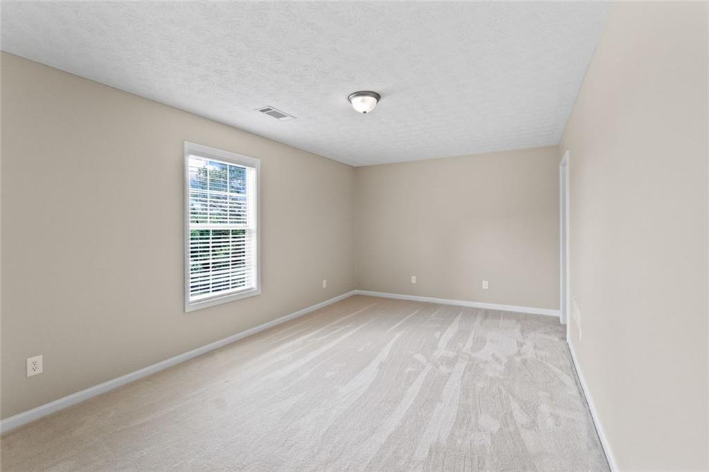 241 Red Bud Road Jefferson, GA 30549 - Photo 34 of 43 a view of an empty room with a window