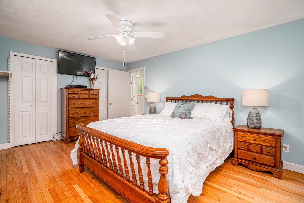 155 Groton Road Shirley, MA 01464 - Photo 16 of 42 a bedroom with bed and wooden floor