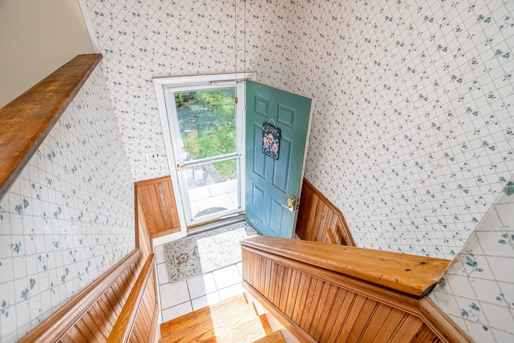 155 Groton Road Shirley, MA 01464 - Photo 22 of 42 a view of wooden floor and a fireplace