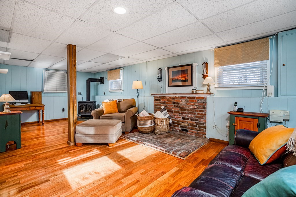 155 Groton Road Shirley, MA 01464 - Photo 24 of 42 a bedroom with furniture and a fireplace