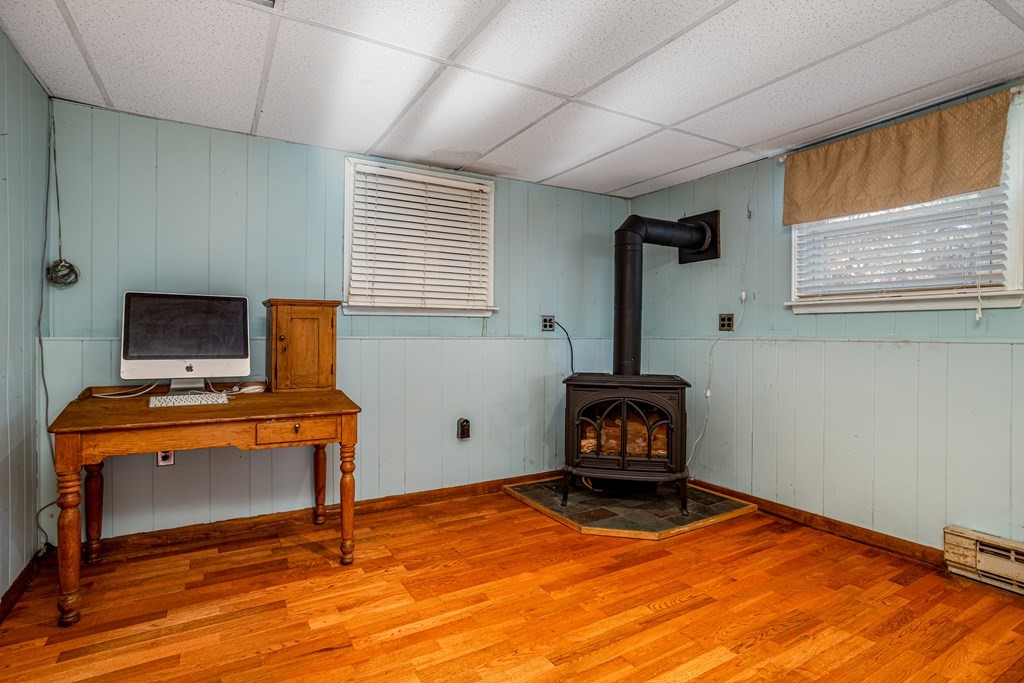 155 Groton Road Shirley, MA 01464 - Photo 25 of 42 a bedroom with a bed and a desk