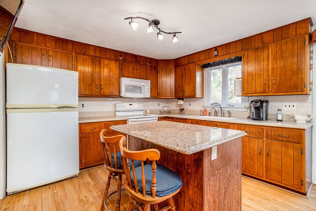 155 Groton Road Shirley, MA 01464 - Photo 3 of 42 a kitchen with stainless steel appliances granite countertop a sink stove and refrigerator