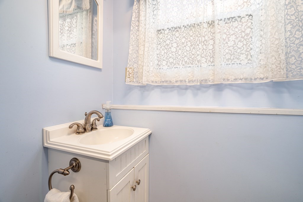155 Groton Road Shirley, MA 01464 - Photo 32 of 42 a bathroom with a sink and a mirror