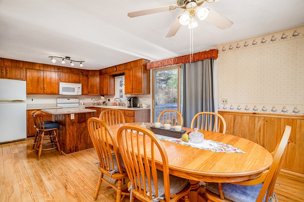 155 Groton Road Shirley, MA 01464 - Photo 10 of 42 a dining room with furniture a chandelier and a dining table