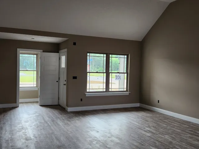 a front view of a house with yard