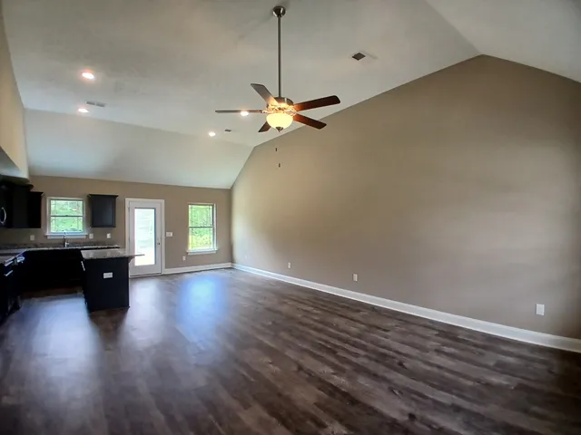 a bathroom with a toilet a sink a bathtub and mirror