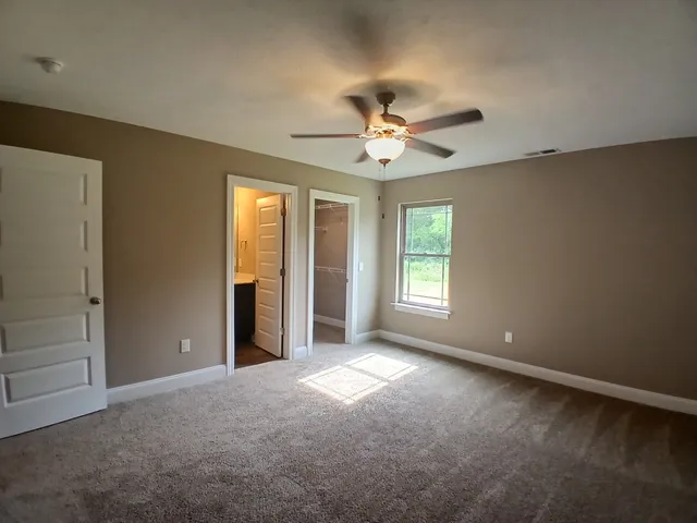 a large kitchen with granite countertop a stove top oven a sink and dishwasher with wooden floor