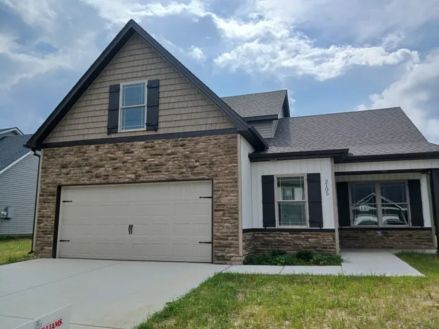 a kitchen with a sink and a refrigerator