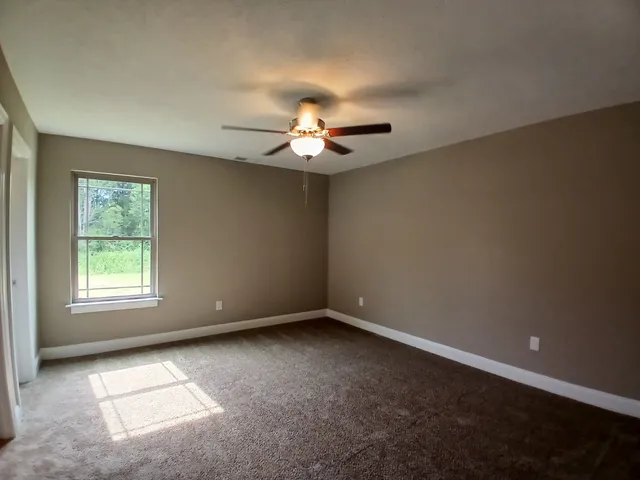 a kitchen that has a sink and a stove in it