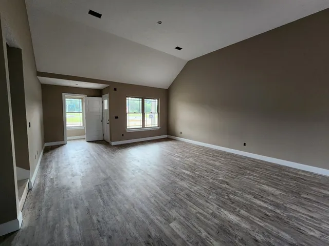 a view of a house with backyard porch and garden
