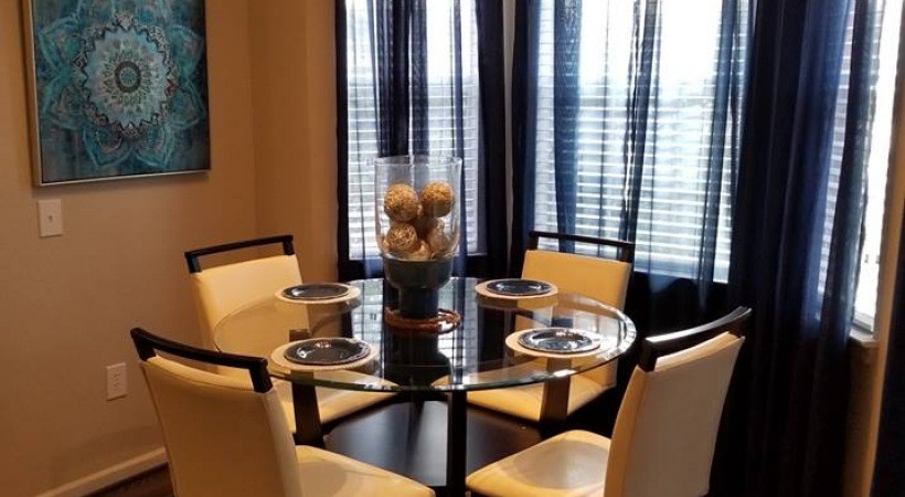 3102 Bay Area Boulevard, Unit 212 Friendswood, TX 77546 - Photo 4 of 15 a view of a dining room with furniture and window