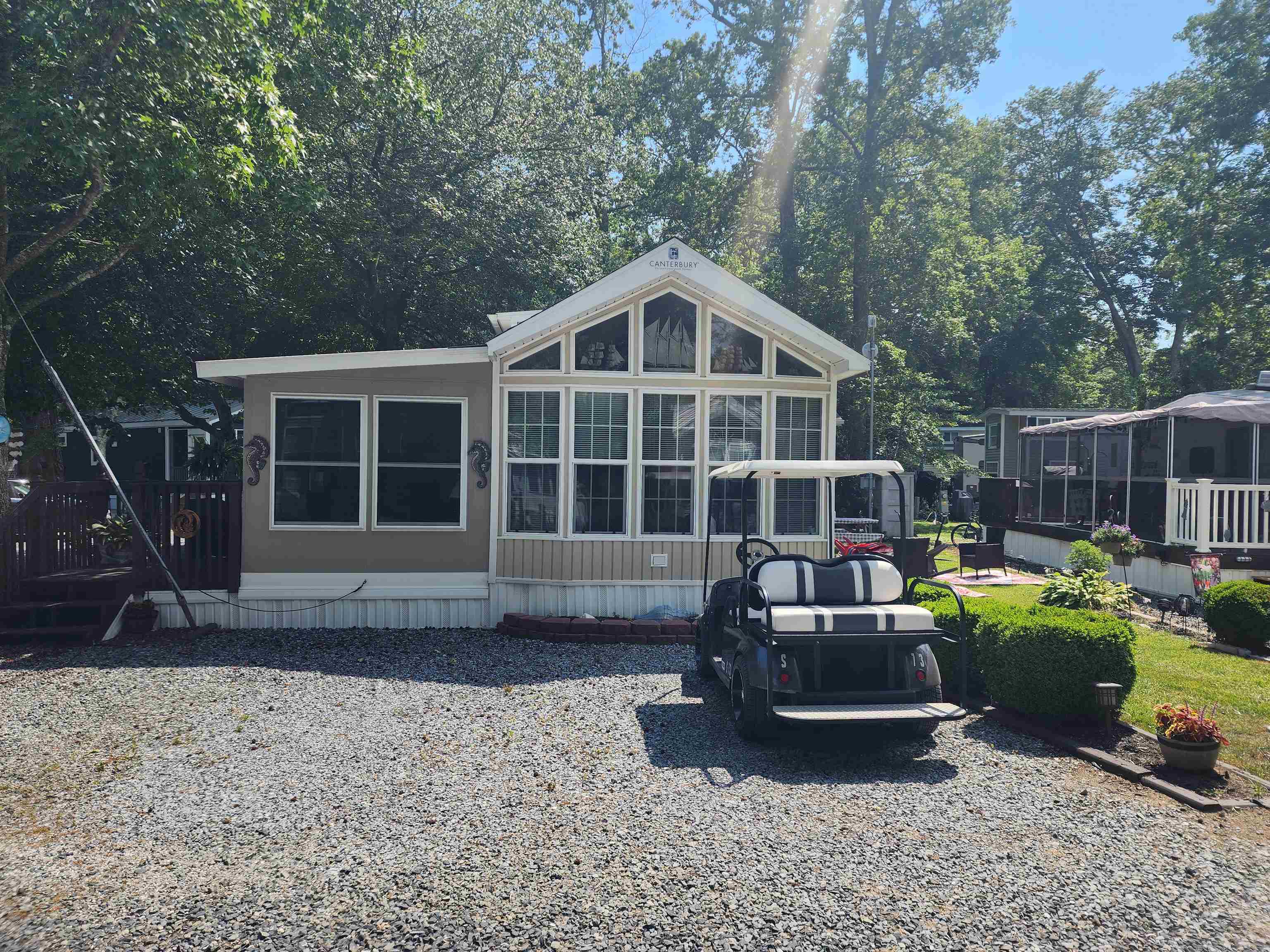 491 Highway 9, Unit 275 Cape May, NJ 08204 - Photo 1 of 15 a view of a house with backyard sitting area and garden