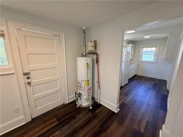 a view of a room with wooden floor